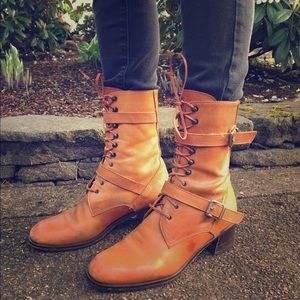 Lace up leather boots with functional buckles